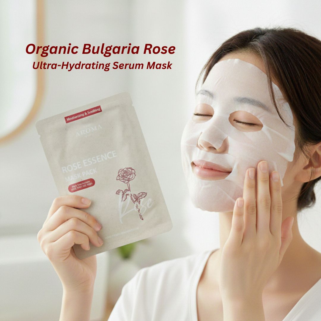 Woman applying an Organic Bulgaria Rose Ultra-Hydrating Serum Mask with the product packaging in front.