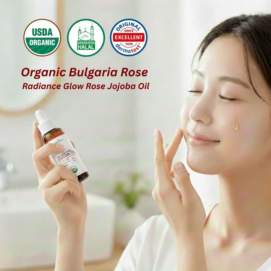 Woman holding a bottle of Organic Bulgaria Rose Radiance Glow Rose Jojoba Oil with certification logos above her.