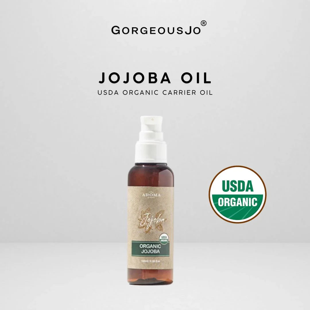 Bottle of Organic Jojoba Oil with USDA Organic label on a white background