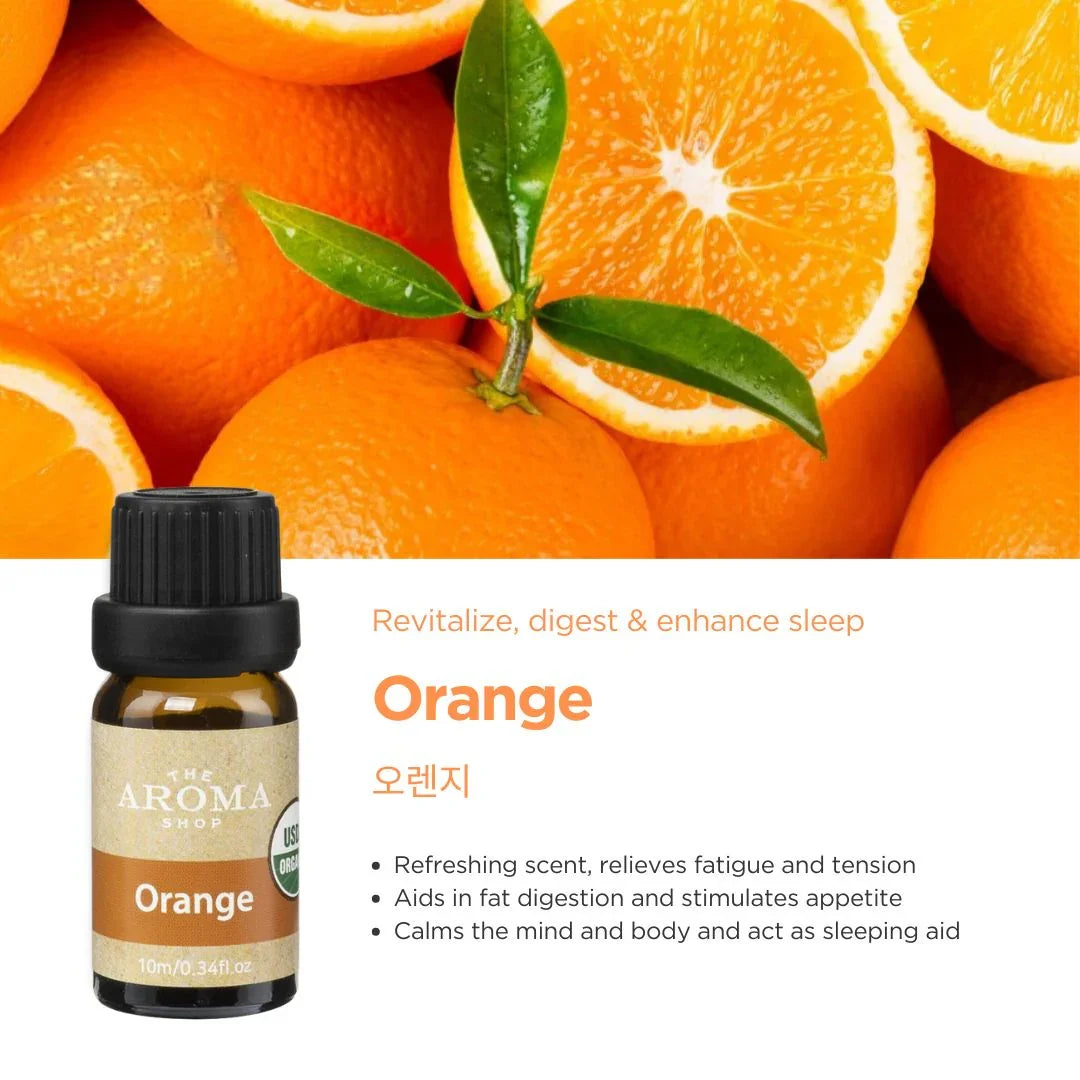 Orange essential oil bottle with sliced oranges and leaves on a white background